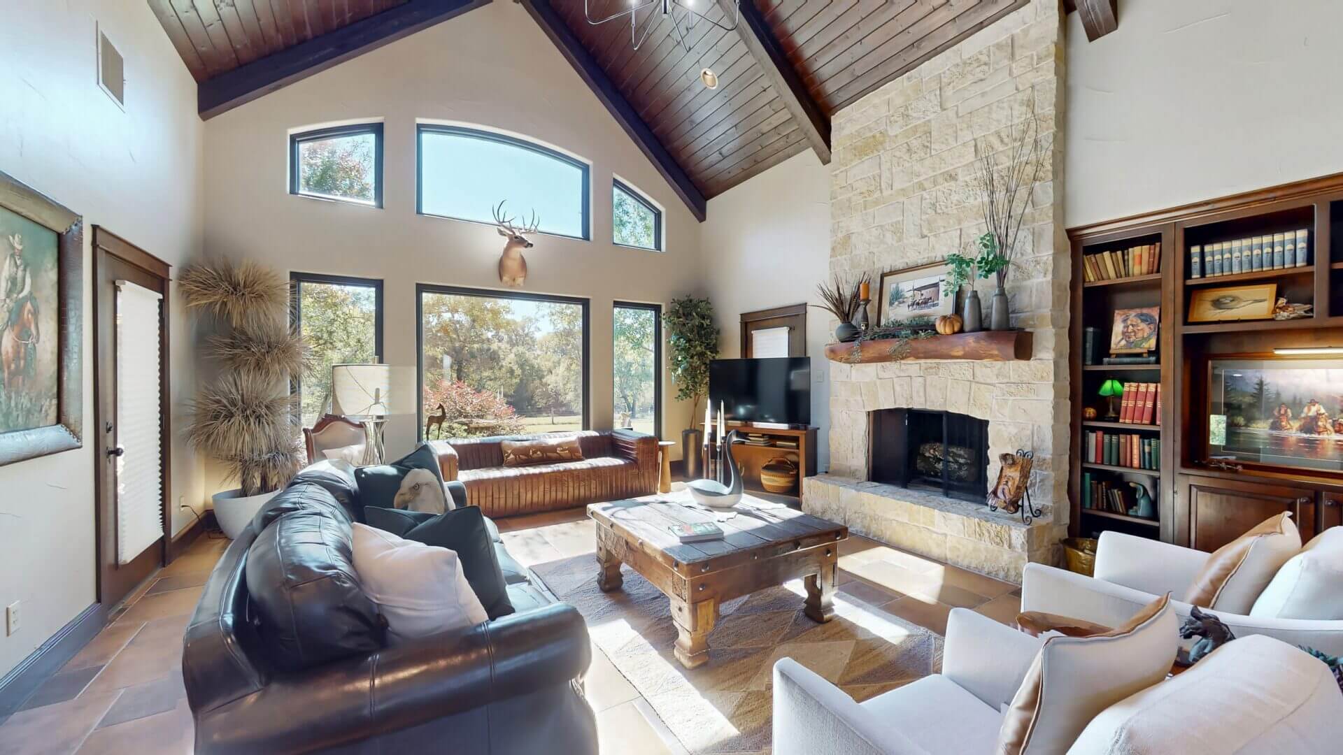 Elegant room featuring stone fireplace