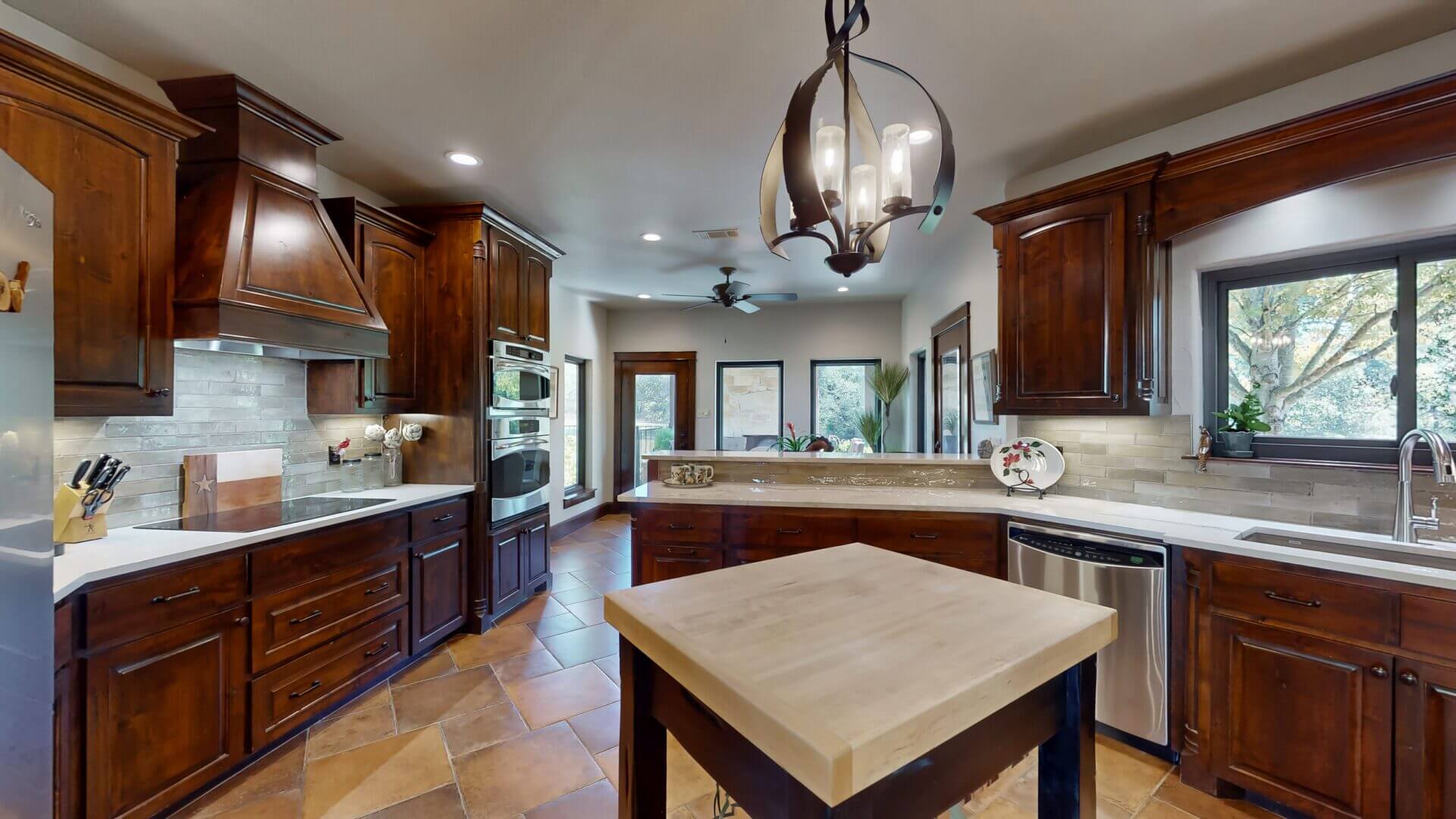 Modern kitchen with island and chandelier