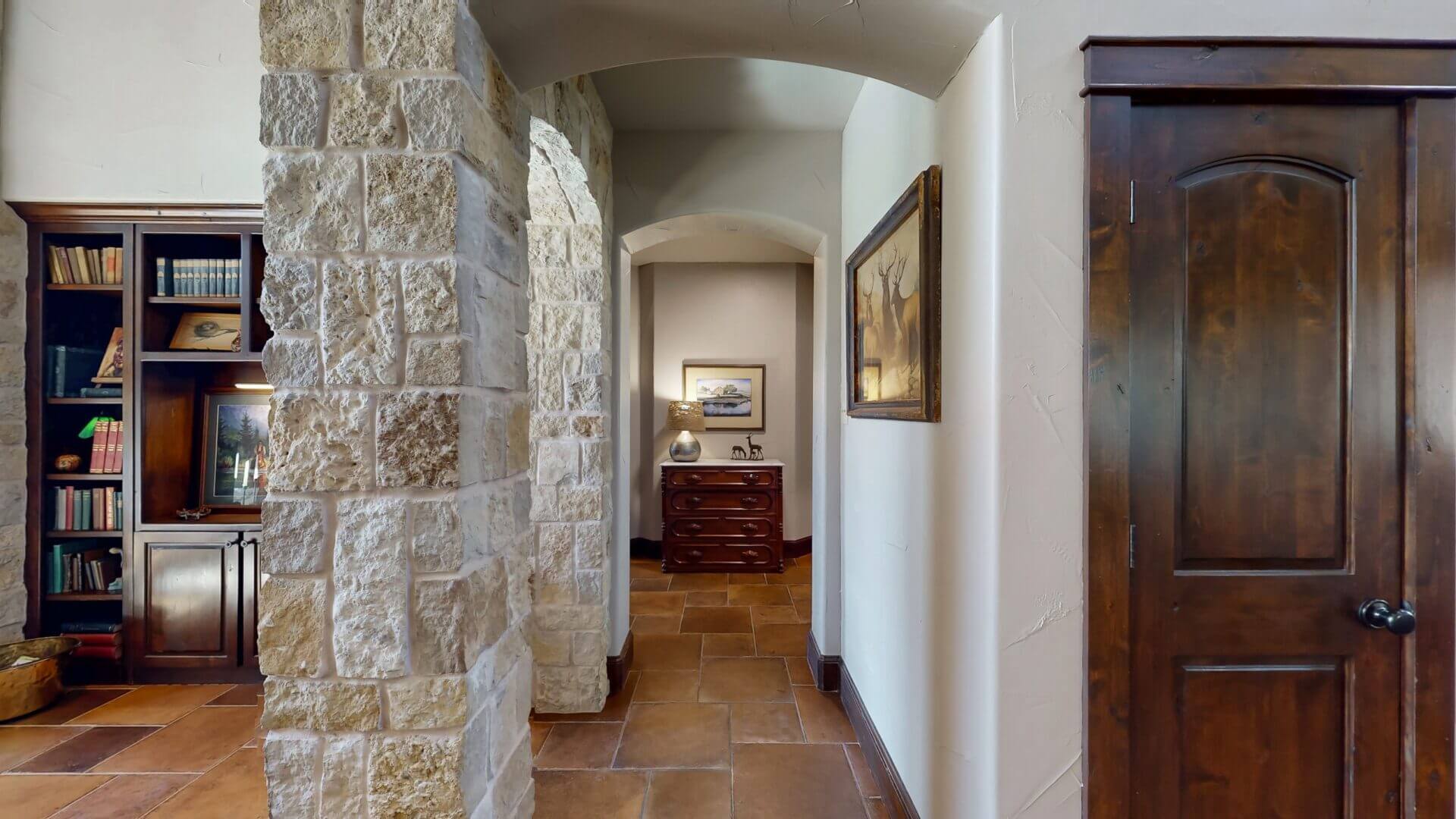 Stone hallway with wooden door