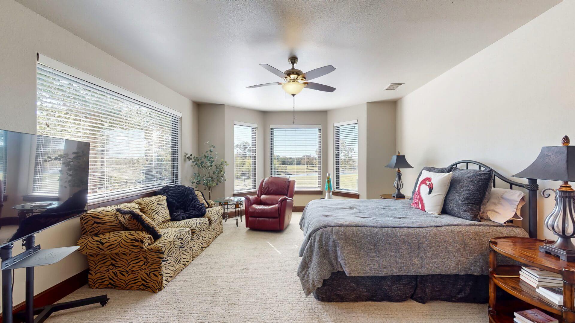 Modern bedroom featuring a ceiling fan
