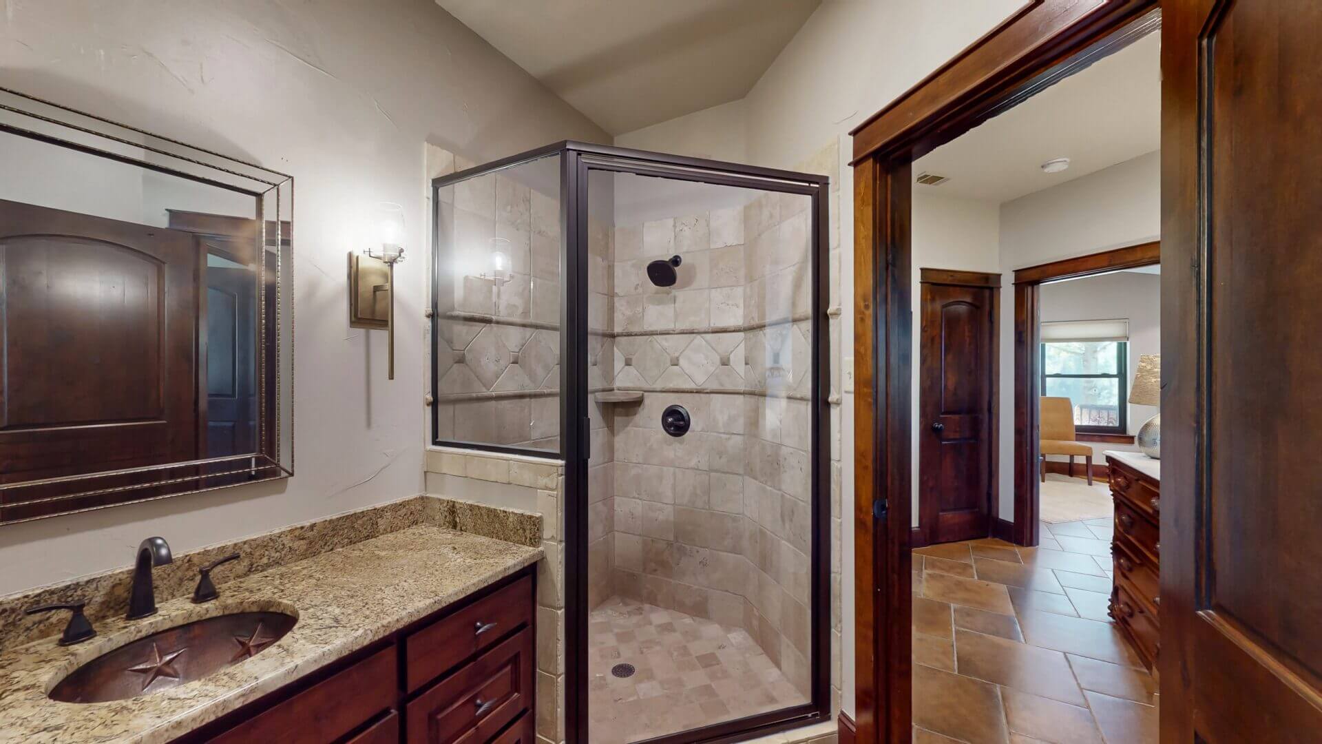 Bathroom featuring granite countertop and mirror