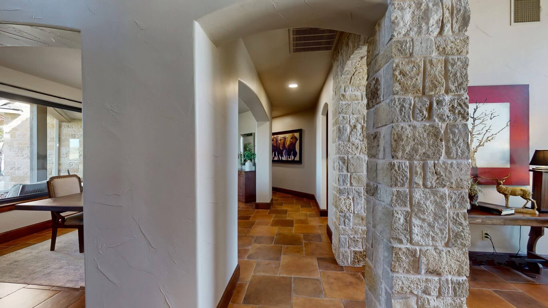 Stone archway in modern hallway