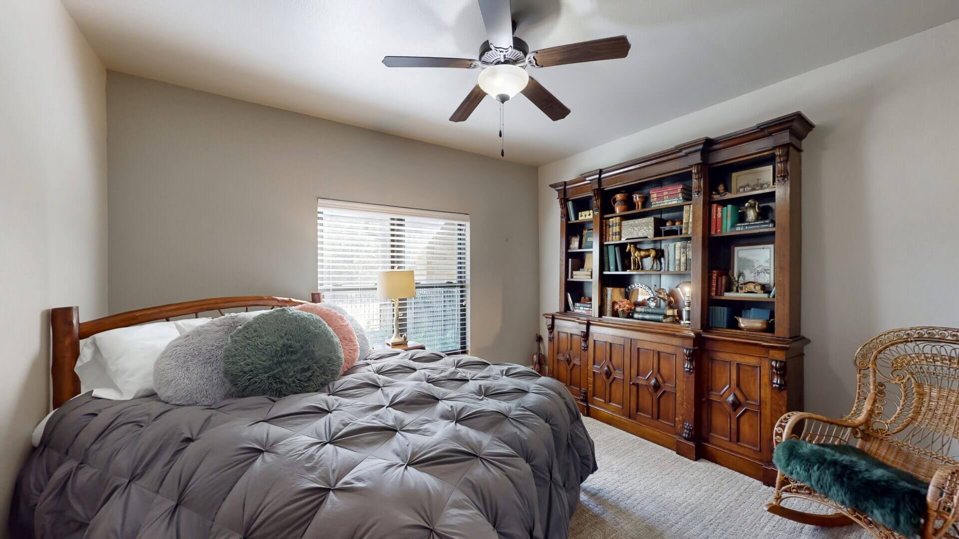 Bedroom featuring a large bookshelf