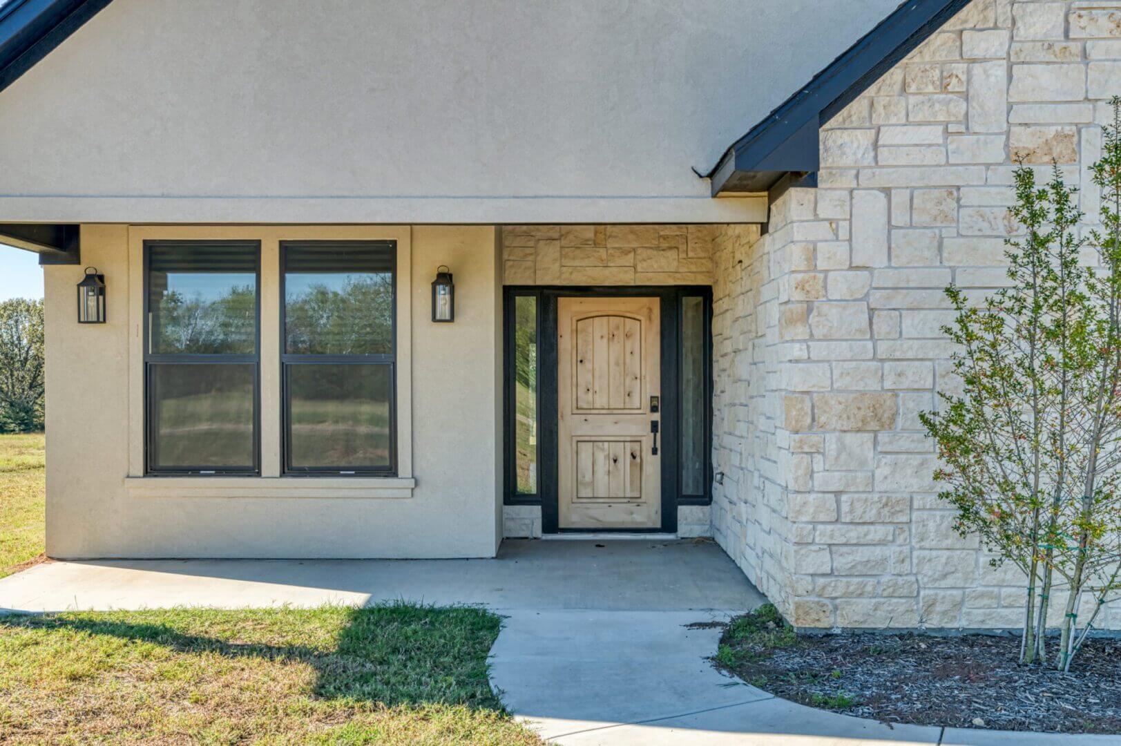 House entrance with stone wall