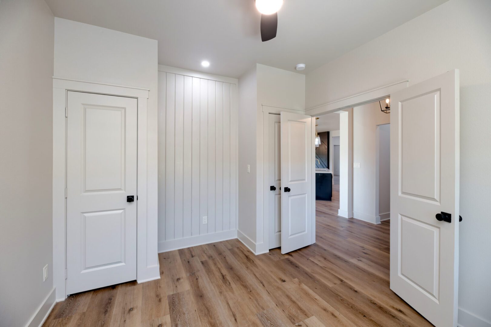Minimalist room with white doors