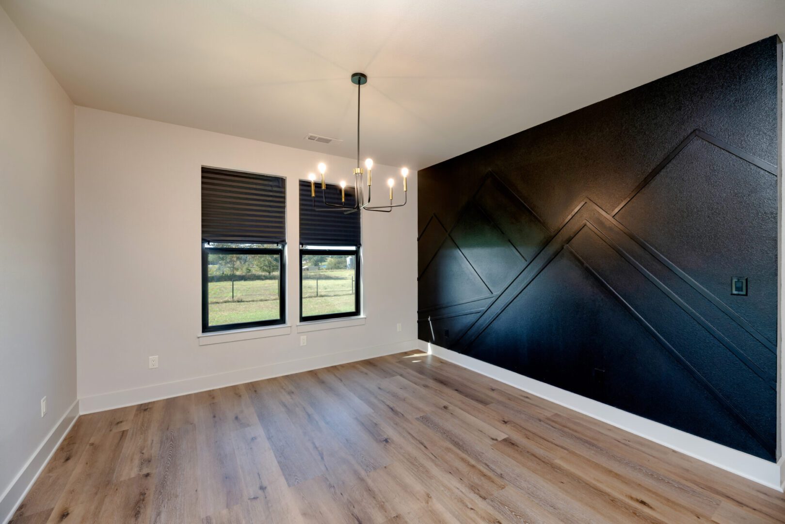 Minimalist room with wooden flooring