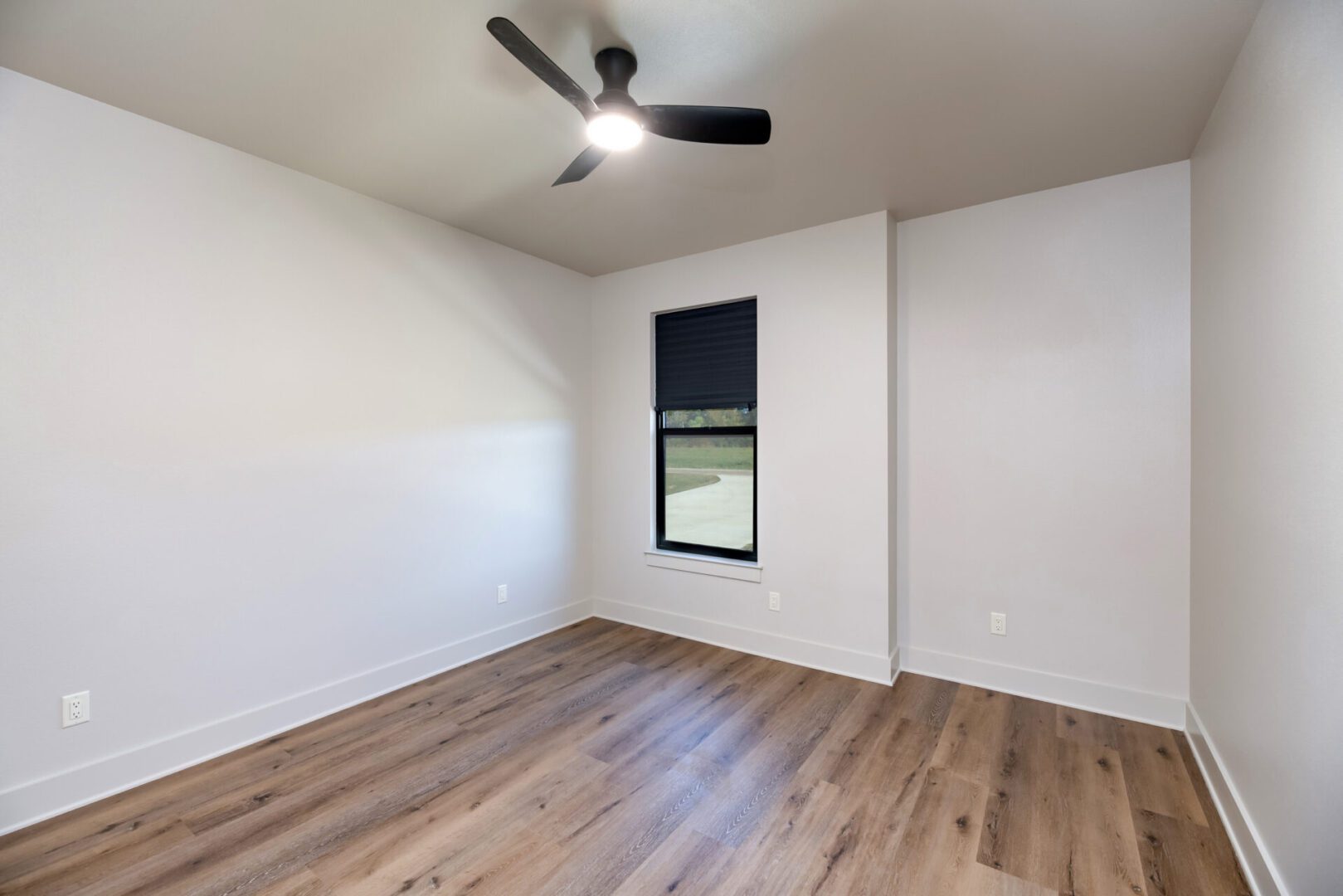 Minimalist room with ceiling fan