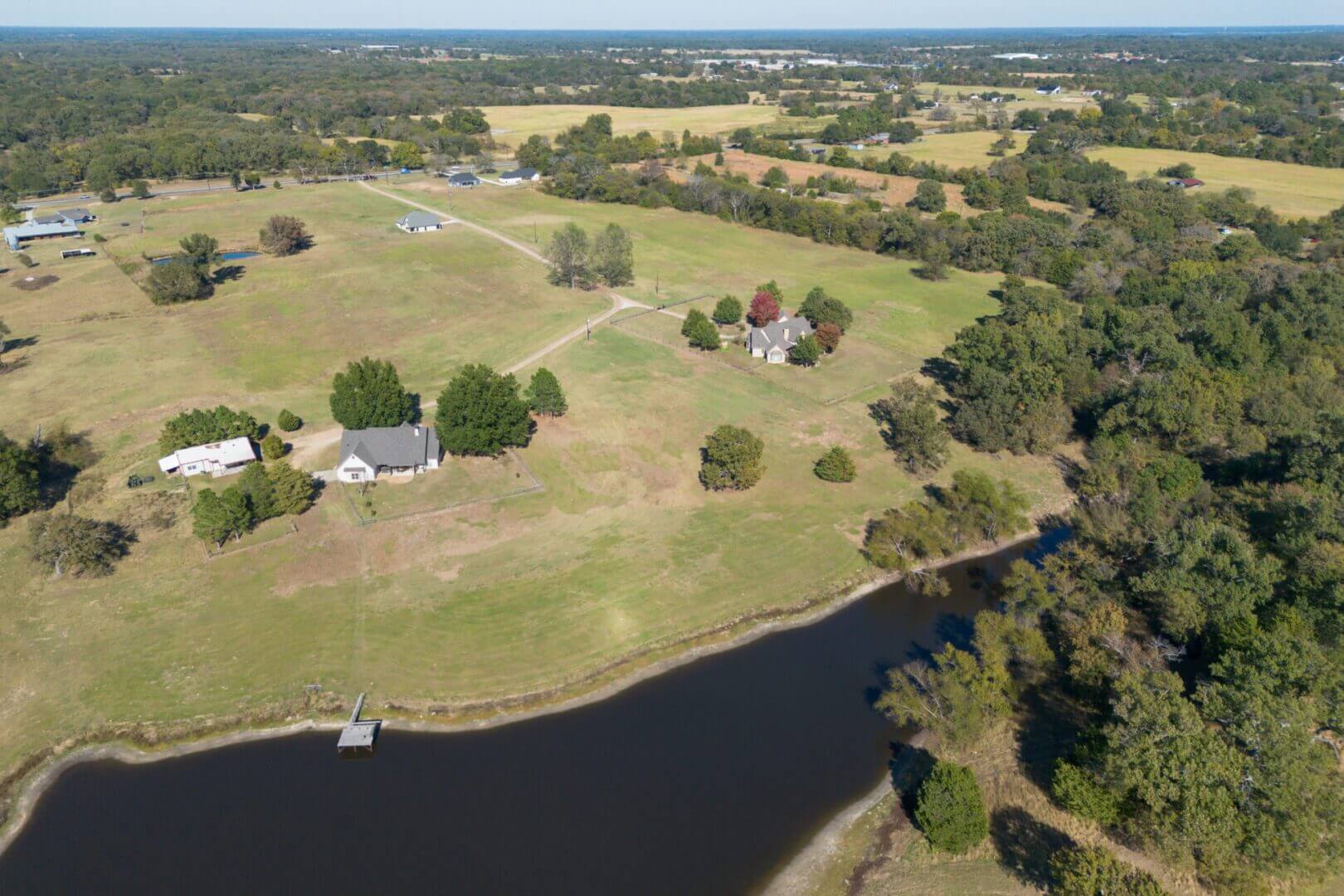 Scenic farmland with scattered houses and trees